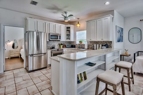 Kitchen with a glance into the downstairs 2nd Master Bedroom