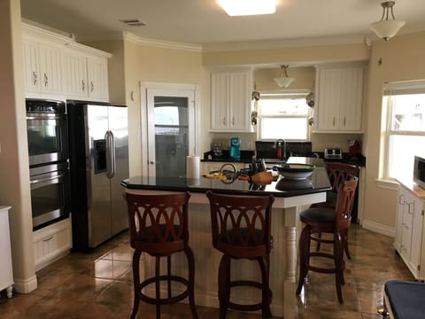 Large kitchen w/double ovens, gas range  walkin pantry, wrap around granite bar
