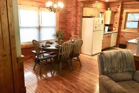 Main level living room opens to dining area and galley kitchen