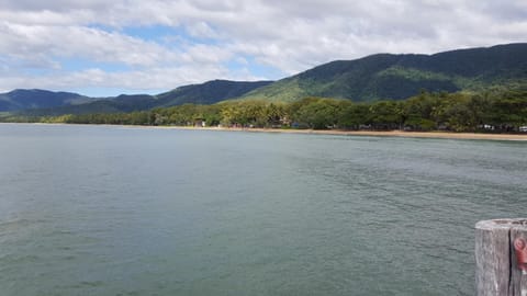 Beach nearby, white sand, sun loungers