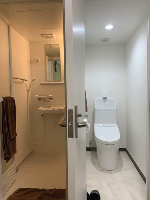 Single Room Shower room type, Non Smoking | Bathroom | Hair dryer, slippers, towels, soap