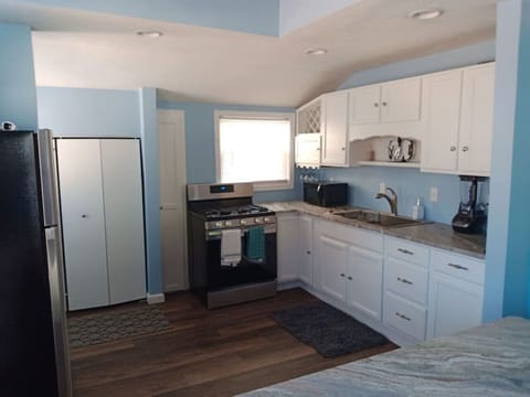 Kitchen with granite counter tops and gas stove