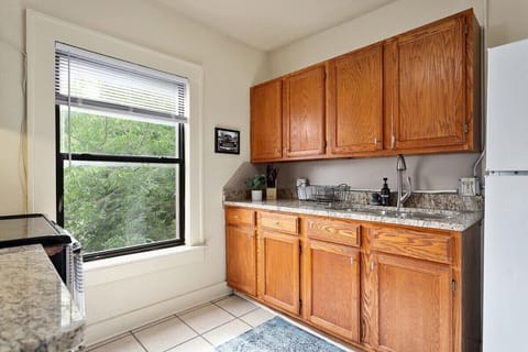 An alternative view of our kitchen, complete with a 4-burner stove, refrigerator with freezer, microwave, and everything else you could need to prepare a full meal.