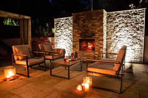 Outside lounge and wood fireplace