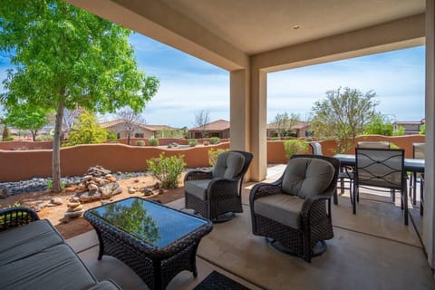 Beautiful covered patio off dining room with lounge + dining seating
