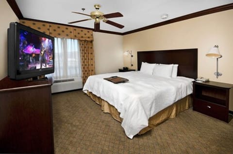 Suite, 1 King Bed, Jetted Tub | In-room safe, desk, iron/ironing board, free cribs/infant beds