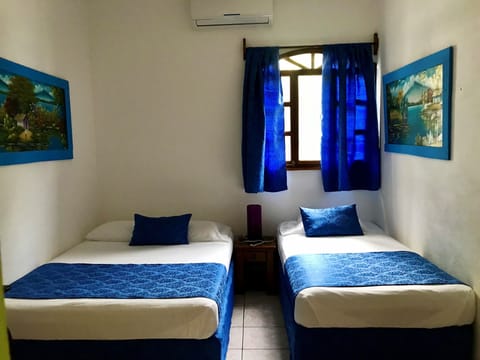 Basic Triple Room | Iron/ironing board, free WiFi, bed sheets