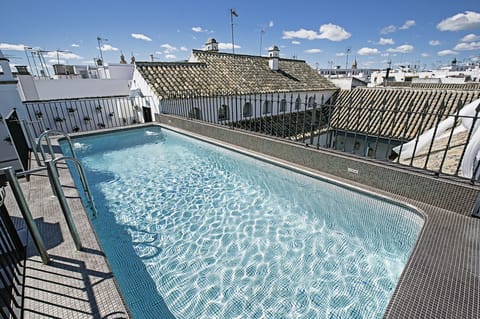 Outdoor pool, open 10:00 AM to 8:00 PM, pool umbrellas, sun loungers