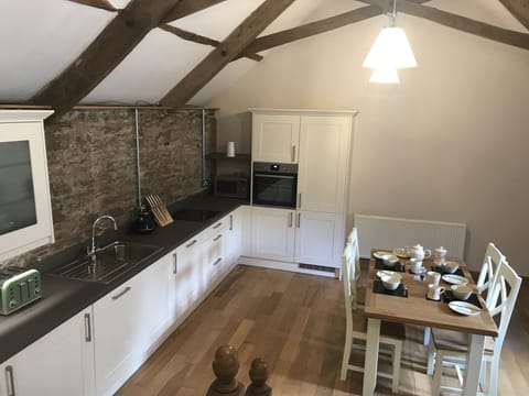 Kitchen with fridge/freezer, dishwasher, microwave and washer/dryer.