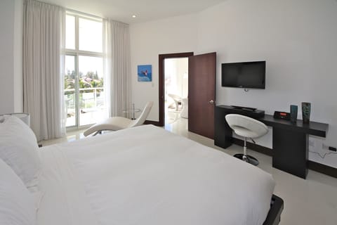 Suite, 1 Bedroom | In-room safe, laptop workspace, blackout drapes, iron/ironing board