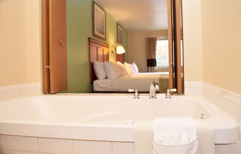 Two Queens Jacuzzi | In-room safe, desk, iron/ironing board, free WiFi