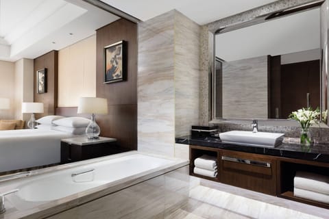 Executive Suite, 1 King Bed | Bathroom | Separate tub and shower, rainfall showerhead, free toiletries