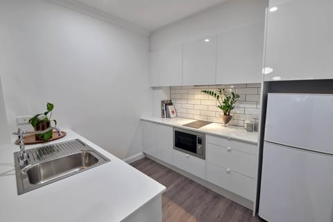 Apartment, Non Smoking, City View | Private kitchen | Full-size fridge, microwave, oven, stovetop