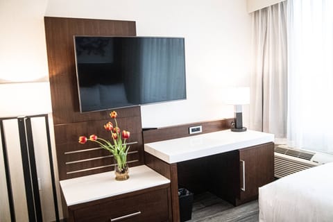 Desk, laptop workspace, blackout drapes, iron/ironing board