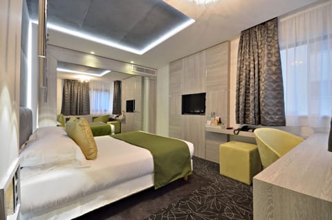 Superior Room | Minibar, in-room safe, individually decorated, individually furnished