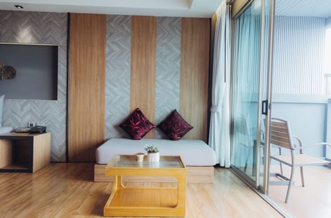 Deluxe Room, Balcony, Sea View | Minibar, in-room safe, desk, laptop workspace