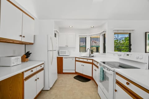 Kitchen is fully equipped with pots, pans and utensils