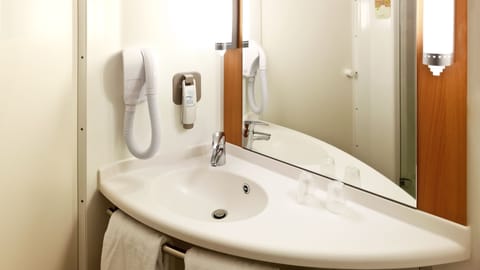 Shower, eco-friendly toiletries, hair dryer, towels