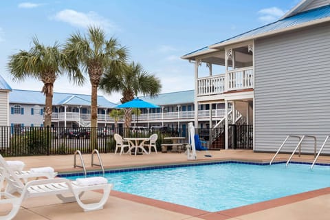 Seasonal outdoor pool, open 9:00 AM to 10:00 PM, pool umbrellas