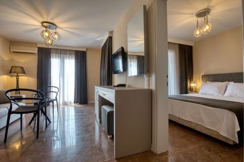 Family Suite | Living area | 32-inch LCD TV with satellite channels, TV, heated floors