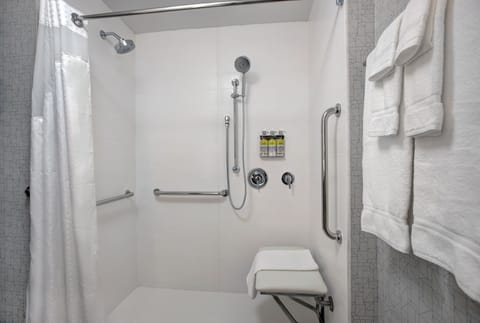 Suite, 2 Queen Beds | Bathroom | Combined shower/tub, hair dryer, towels, soap