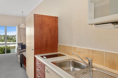 Fridge, microwave, stovetop, coffee/tea maker