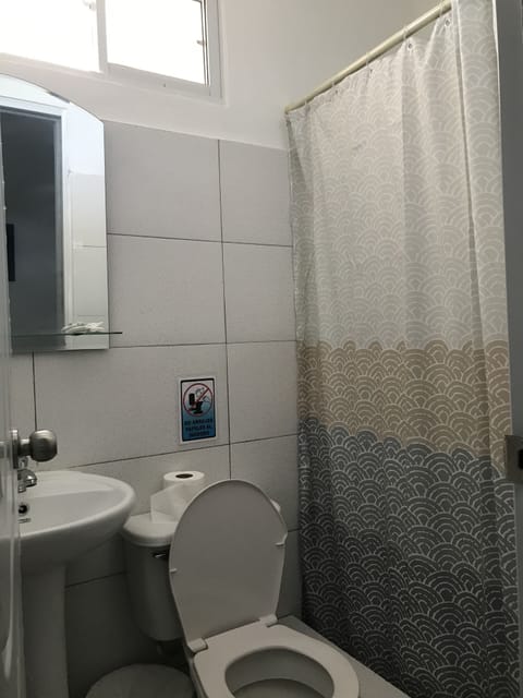 Basic Single Room, 1 Queen Bed | Bathroom | Shower, rainfall showerhead, towels