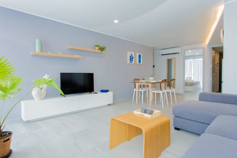 Signature Apartment | Living area | 40-inch LCD TV with satellite channels, TV