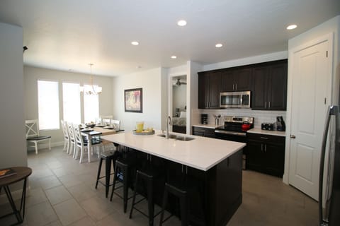 Quartz countertops, stainless steel appliances, seating for 12