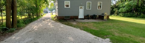 Large yard with long driveway.