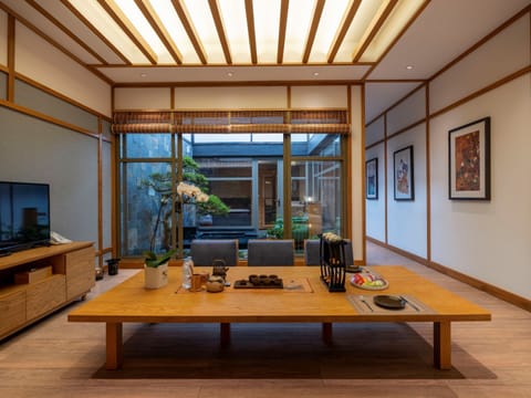 Washitsu Omoteashi with Public Onsen | Living area | Smart TV