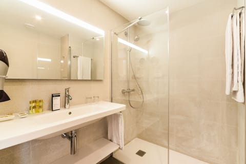 Shower, eco-friendly toiletries, hair dryer, towels