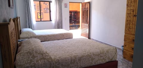 Basic Quadruple Room, 2 Queen Beds | Laptop workspace, free WiFi, bed sheets