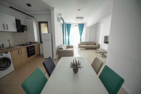 Family Apartment | Living room | 110-cm flat-screen TV with cable channels