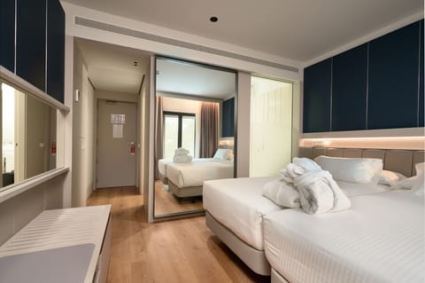 Deluxe Room, Balcony | Minibar, in-room safe, soundproofing, iron/ironing board
