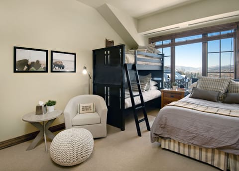 Second bedroom with twin bunk beds and queen bed. Dresser and TV not shown.