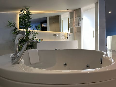 Luxury Room | Bathroom | Designer toiletries, hair dryer, slippers, towels