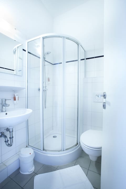 Deep soaking tub, rainfall showerhead, eco-friendly toiletries