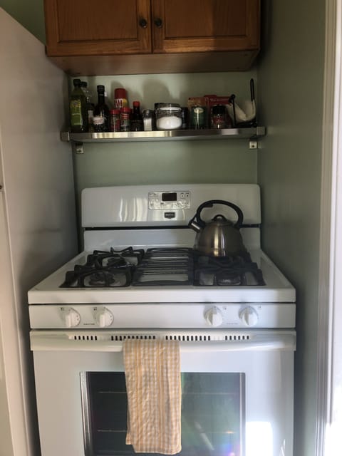 full sized oven with cooking basics stocked for guest use