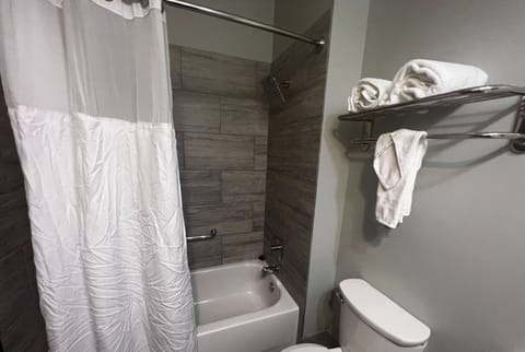 Combined shower/tub, hair dryer, towels, soap