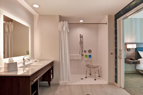 Suite, 1 King Bed, Accessible (Mobility & Hearing, Roll-in Shower) | Bathroom | Hair dryer, towels, soap, shampoo