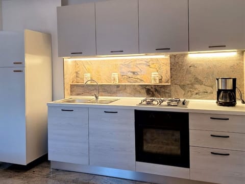 Tap, Cabinetry, Countertop, Property, Sink, Plumbing Fixture, Kitchen, Wood, Kitchen Stove, Kitchen Sink