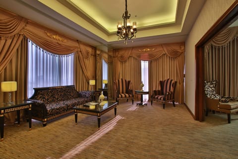 LUXENT SUITE | Living room | 32-inch LCD TV with cable channels, TV, DVD player