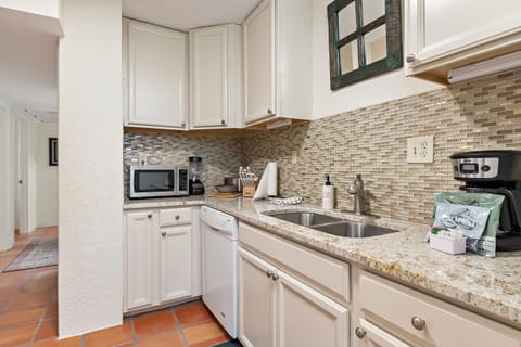 2-Bedroom Condominium | Private kitchen | Fridge, microwave, oven, stovetop