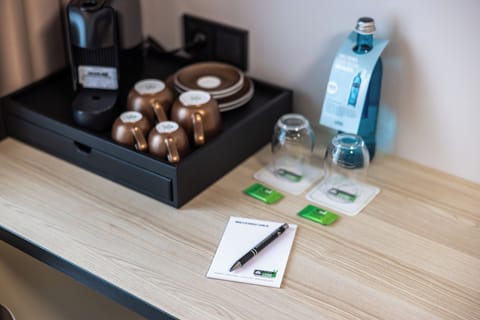 Hypo-allergenic bedding, desk, laptop workspace, blackout drapes