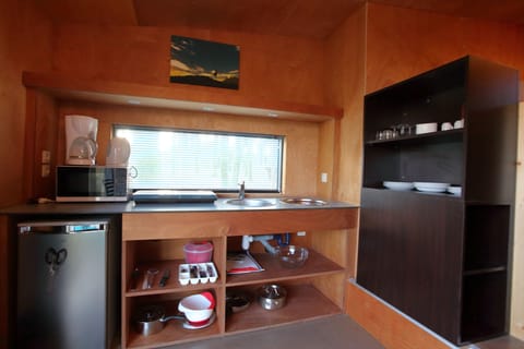 Mini-fridge, microwave, stovetop, coffee/tea maker