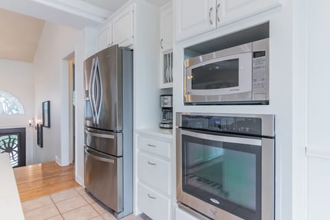 Kitchen is well stocked for cooking in or grilling on the deck.  