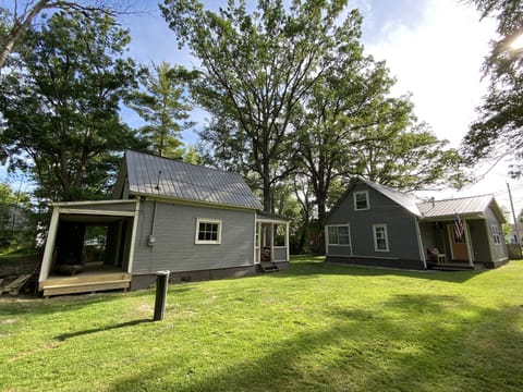 Boat house on the left and main house on the right and secluded back yard