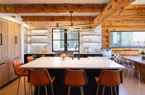 The spacious kitchen with large island to gather round while enjoying meals