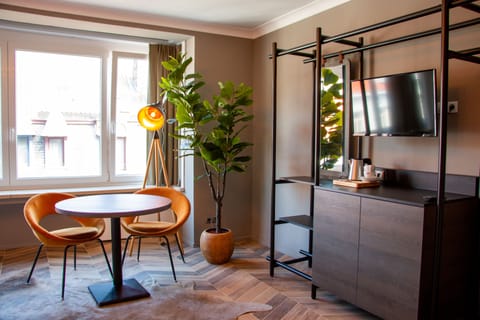 Large Double Room | Living area | Flat-screen TV